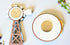 Back of farmhouse-style windmill and wagon wheel magnets from Farmhouse Whimsy magnet set, featuring rustic metal designs.