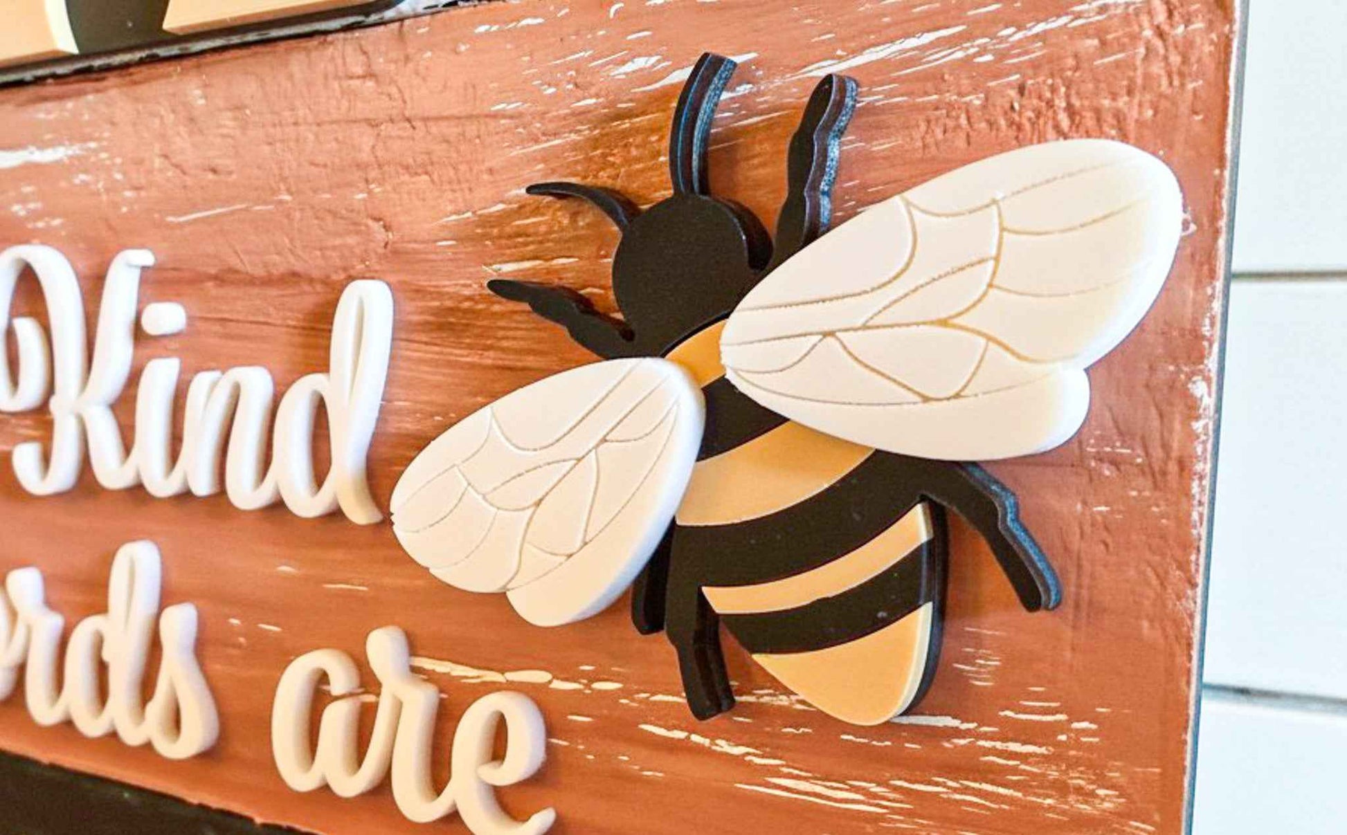 Close-up of a Bumble Bee Tier Block Set table top decor by Farmhouse Whimsy, featuring detailed bee figures on wooden blocks.