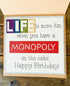 Farmhouse Whimsy board game birthday greeting card featuring colorful game-themed illustrations on a festive card.