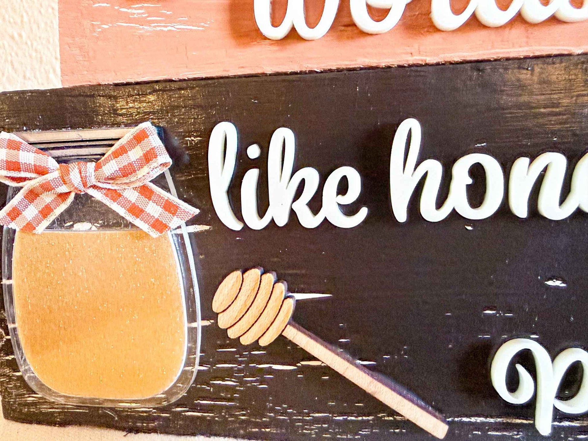 Close-up of a Bumble Bee Tier Block set by Farmhouse Whimsy, featuring honey-themed table top decor with intricate bee designs.