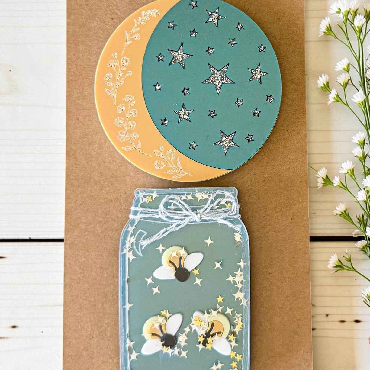 Firefly and moon magnet set from Farmhouse Whimsy, featuring whimsical metal magnets with vibrant firefly and moon designs.