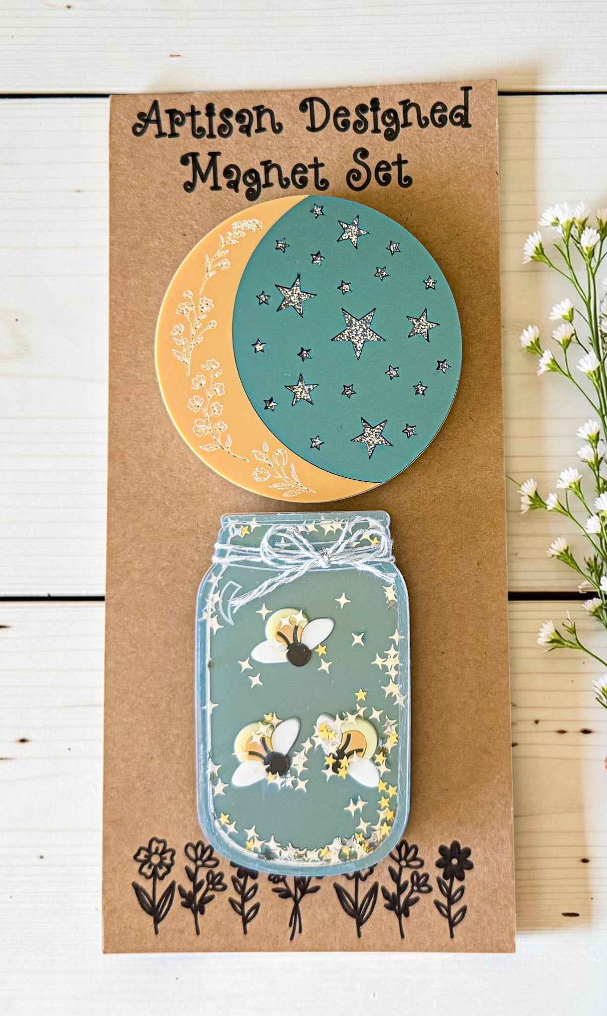 Firefly and moon magnet set from Farmhouse Whimsy, featuring whimsical metal magnets with vibrant firefly and moon designs.
