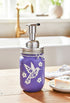 Purple hummingbird mason jar soap dispenser from Farmhouse Whimsy, featuring a detailed hummingbird design on a glass jar.