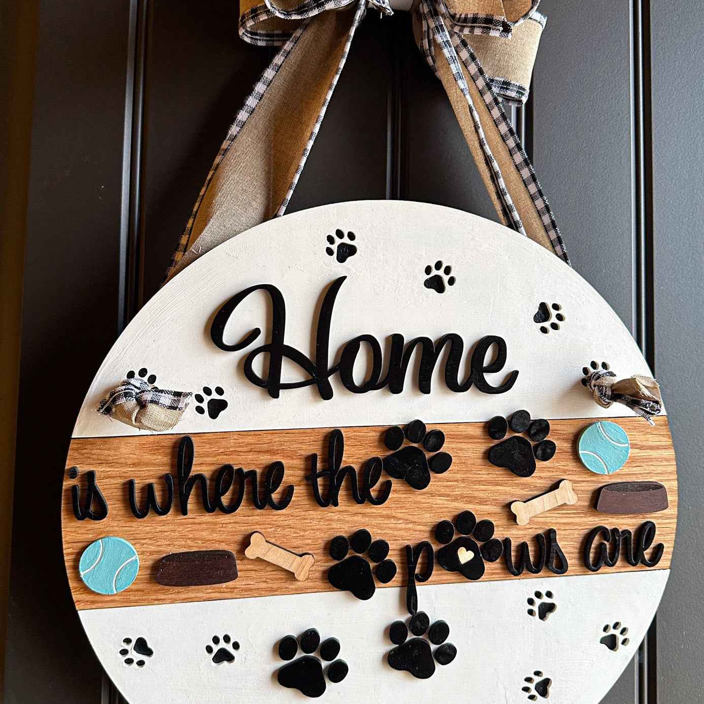 Wooden pet paws farmhouse door sign with rustic design, featuring engraved paw prints and farmhouse style lettering.