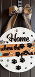Wooden pet paws farmhouse door sign with rustic design, featuring engraved paw prints and farmhouse style lettering.