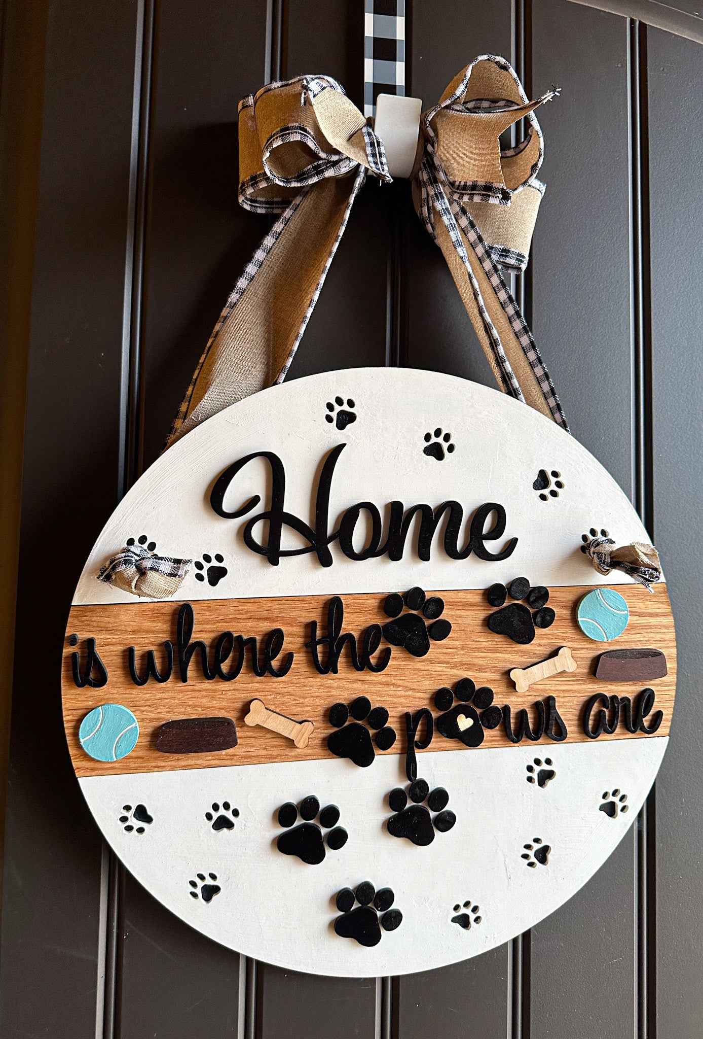 Wooden pet paws farmhouse door sign with rustic design, featuring engraved paw prints and farmhouse style lettering.