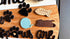 Wooden pet paws farmhouse door sign with rustic design, featuring engraved paw print and "Farmhouse Whimsy" branding.