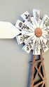 Farmhouse Whimsy windmill and wagon wheel magnet set featuring engraved windmill design on metal magnets.