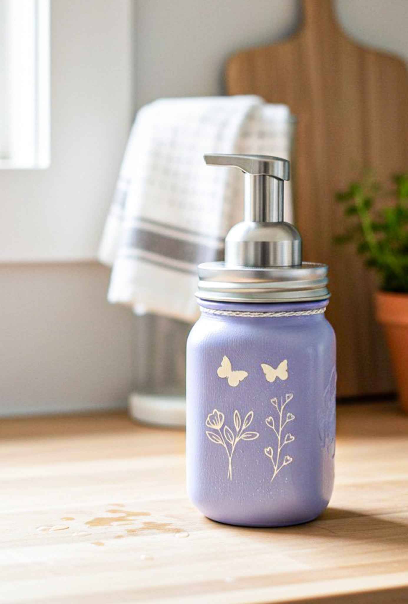 Farmhouse Whimsy butterfly mason jar soap dispenser with peach liquid soap and pump, decorative rustic soap jar for bathroom or kitchen