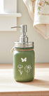 Farmhouse Whimsy butterfly mason jar soap dispenser with peach liquid soap and pump, decorative soap jar for kitchen or bathroom.