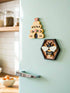 Farmhouse Whimsy bee and hive magnet set featuring colorful, handcrafted magnets with bee and hive designs on a rustic background.
