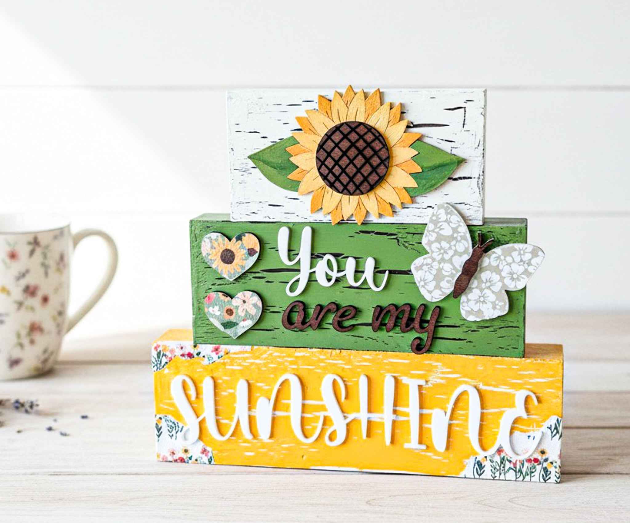 Farmhouse Whimsy sunflower table top decor featuring tiered block set with sunflower design for rustic home accents.
