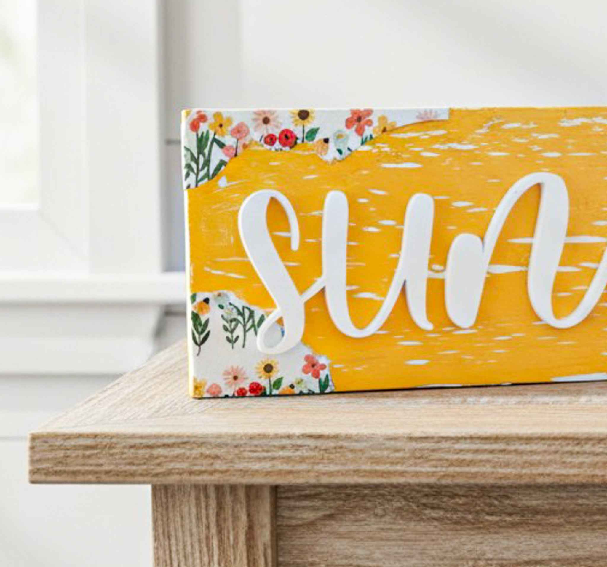 Farmhouse Whimsy sunflower table top decor with tiered block set, featuring bright sunflower designs on a rustic wooden background.