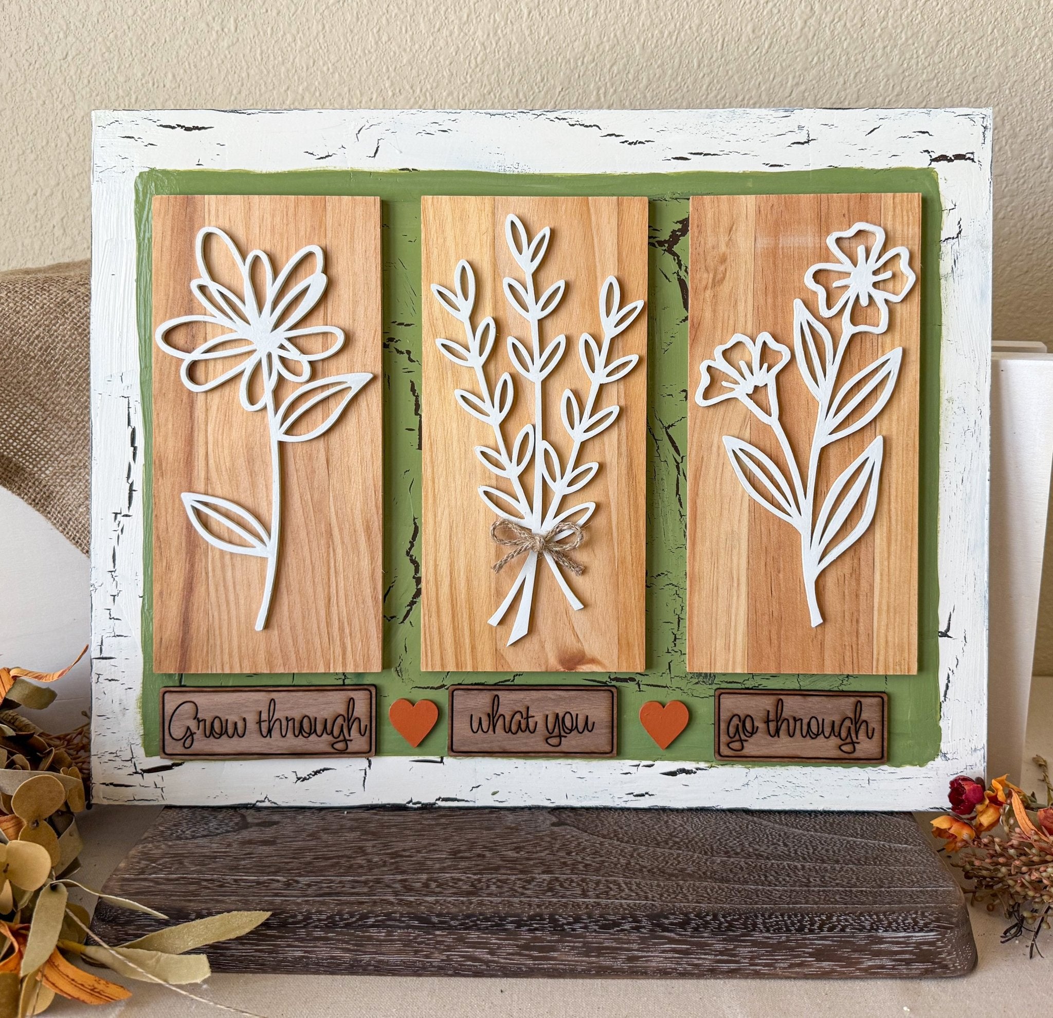 Rustic wooden wall art featuring floral farmhouse design, by Farmhouse Whimsy, showcasing painted flowers on wood planks.