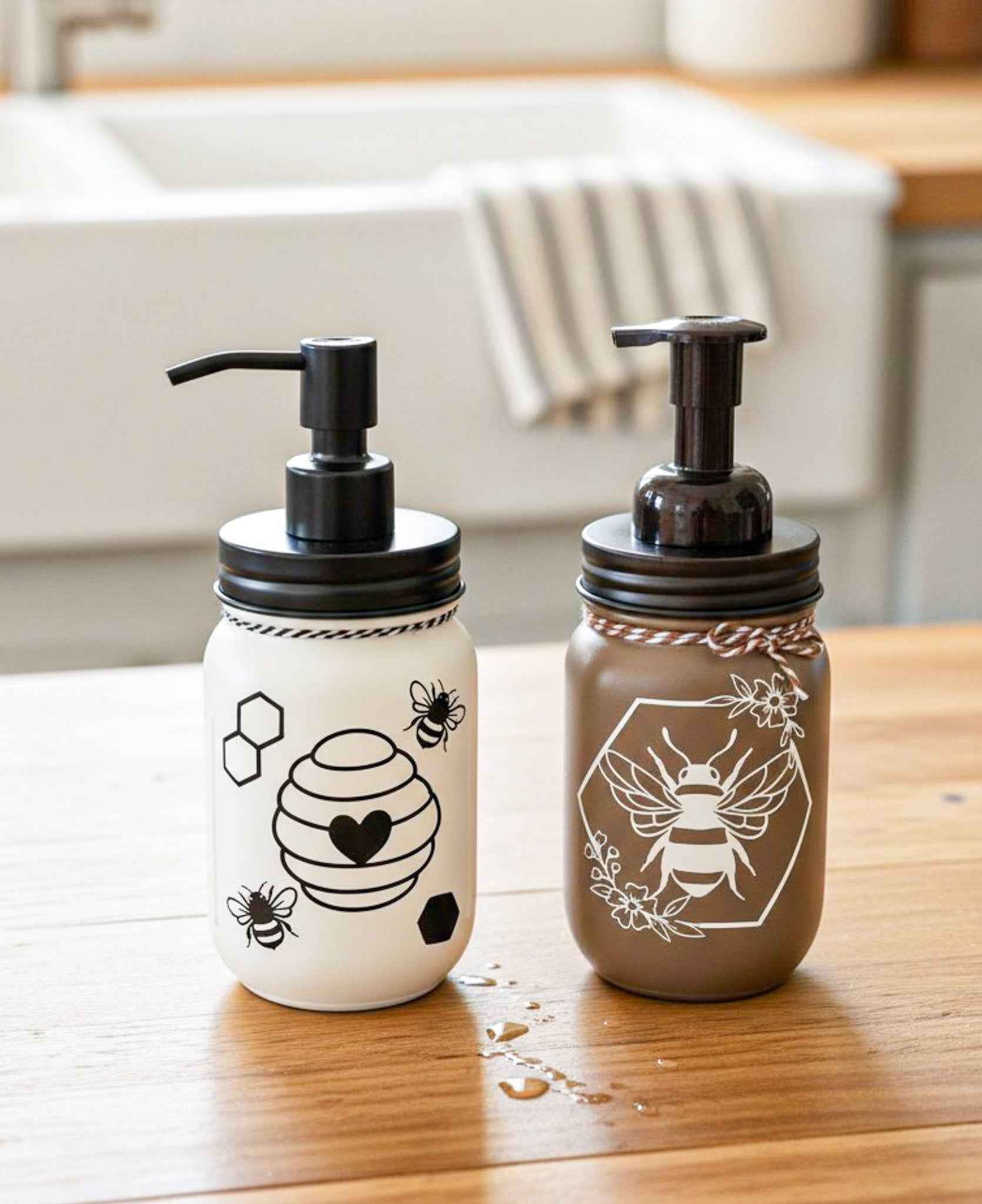 Cream and black Honey Bee Mason Jar soap pump from Farmhouse Whimsy filled with liquid soap and featuring a mason jar design.