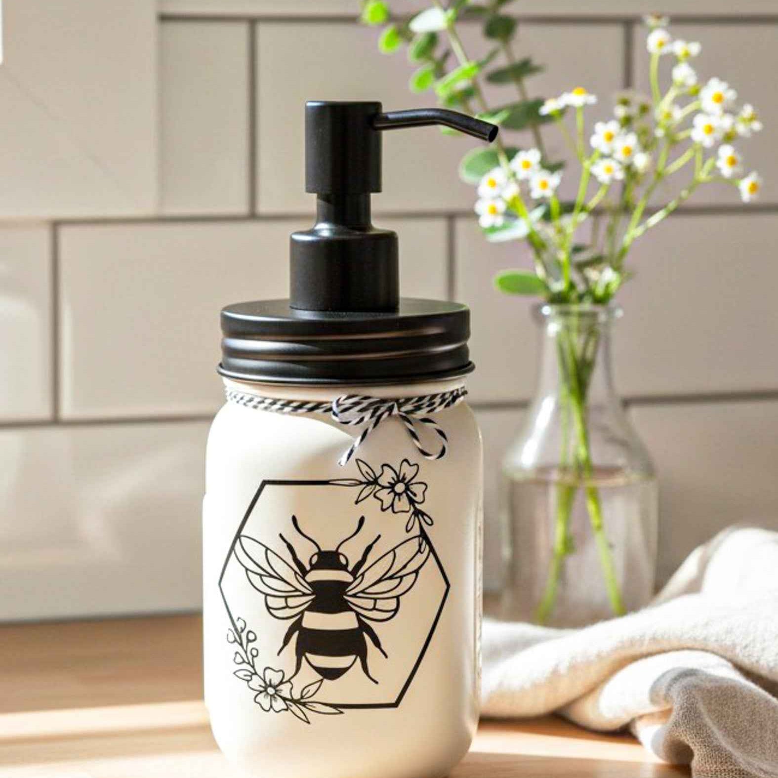 Cream and black Honey Bee Mason Jar soap pump by Farmhouse Whimsy showing a decorative glass soap jar with a pump dispenser.