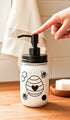 Cream-colored honey bee mason jar soap pump by Farmhouse Whimsy, decorative glass soap jar with black pump and rustic design.