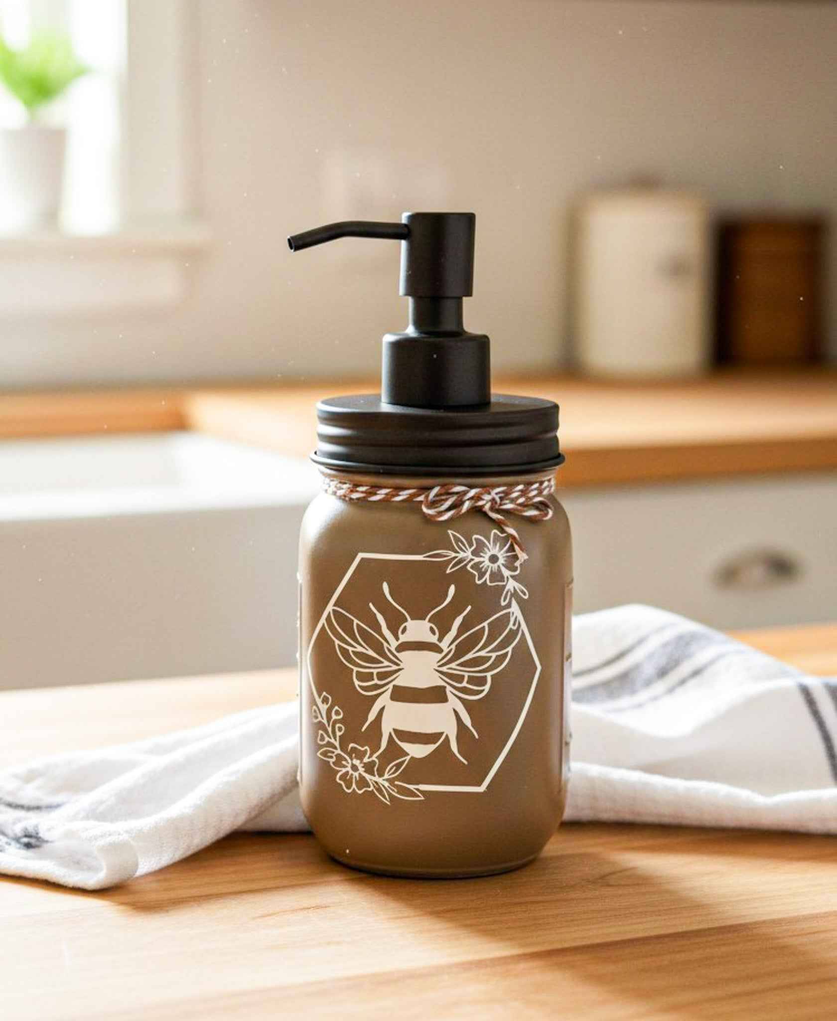 Cream and black Honey Bee Mason Jar soap pump by Farmhouse Whimsy, decorative soap dispenser with mason jar design.