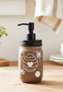 Cream and black Honey Bee Mason Jar soap pump from Farmhouse Whimsy, with a decorative glass jar and pump for liquid soap.