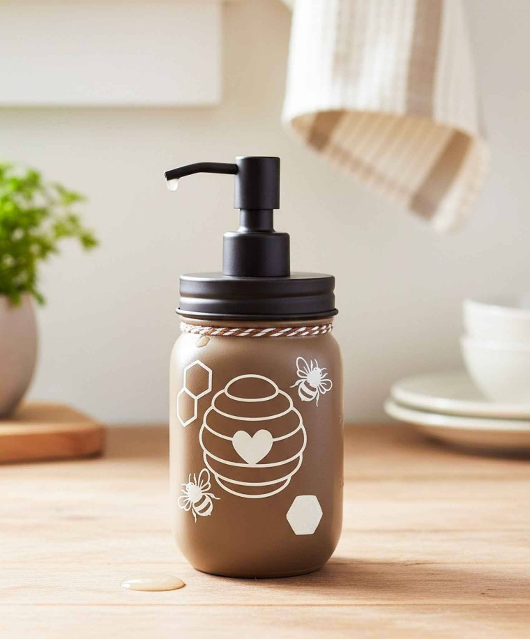 Cream and black Honey Bee Mason Jar soap pump from Farmhouse Whimsy, with a decorative glass jar and pump for liquid soap.