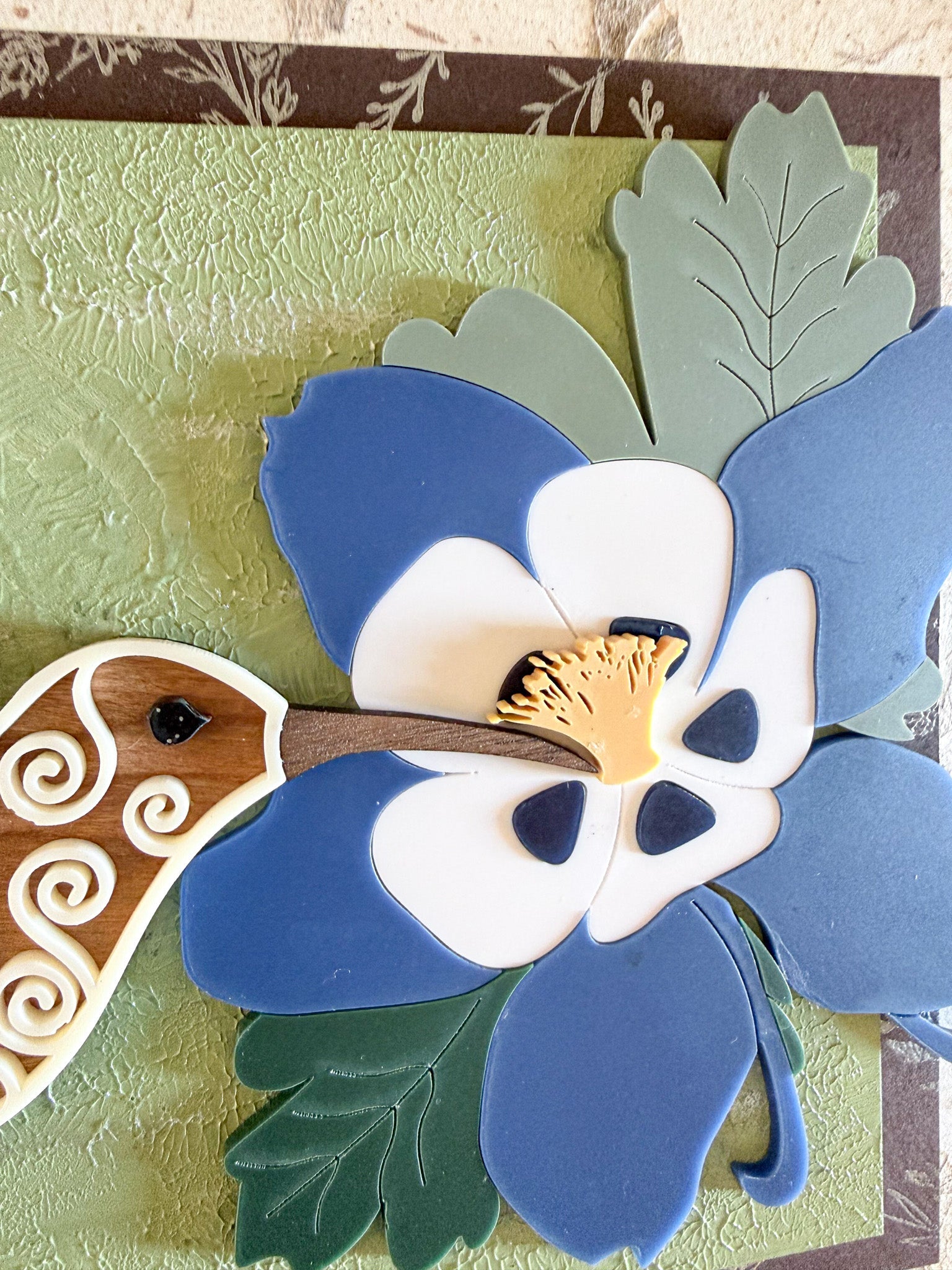 Hummingbird and Columbine flower wall art by Farmhouse Whimsy showing vibrant floral and bird details on a decorative wall art piece.