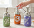 Hummingbird Mason Jar soap dispenser with a clear glass jar and decorative hummingbird design, perfect for farmhouse bathroom decor.