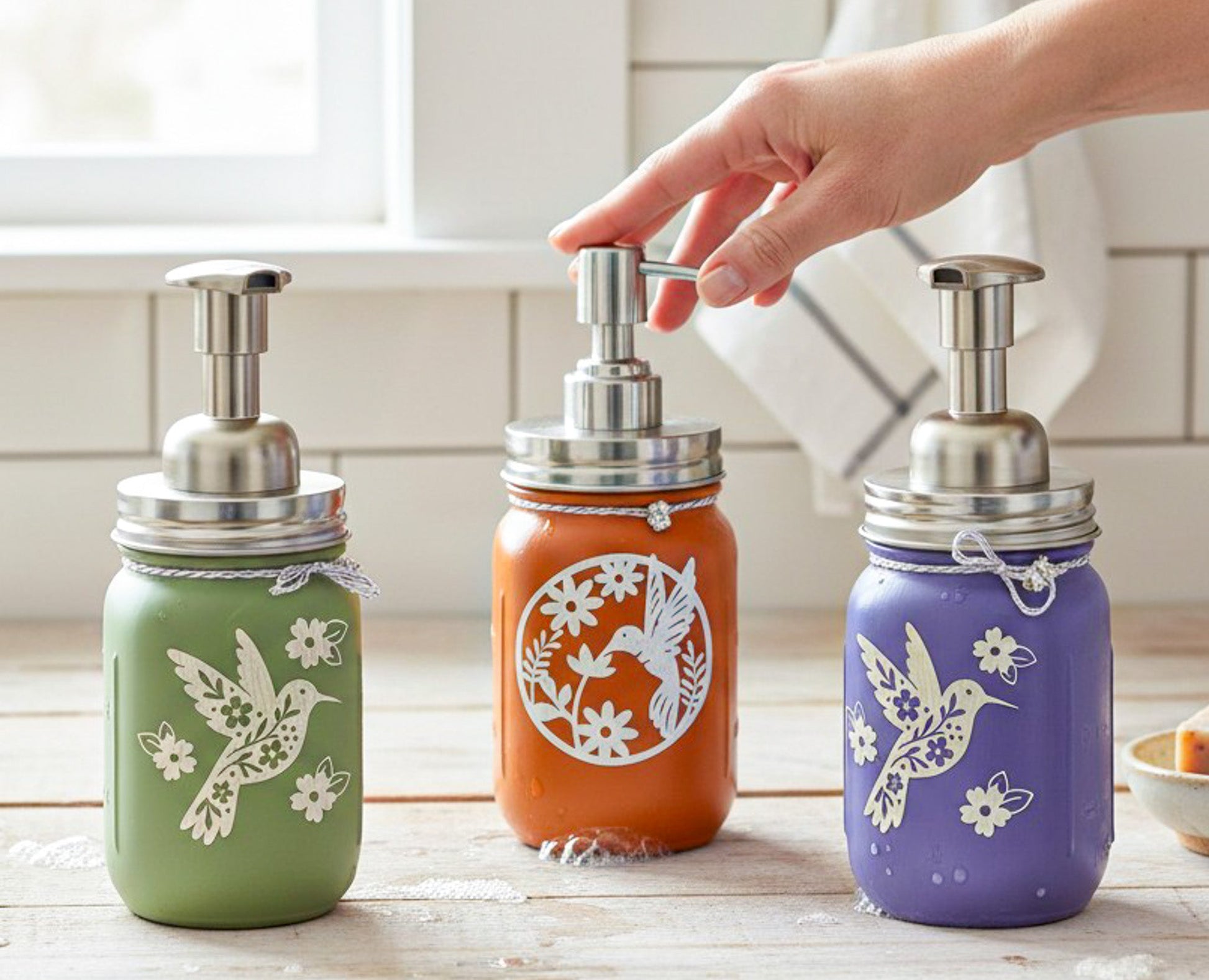 Hummingbird Mason Jar soap dispenser with a clear glass jar and decorative hummingbird design, perfect for farmhouse bathroom decor.