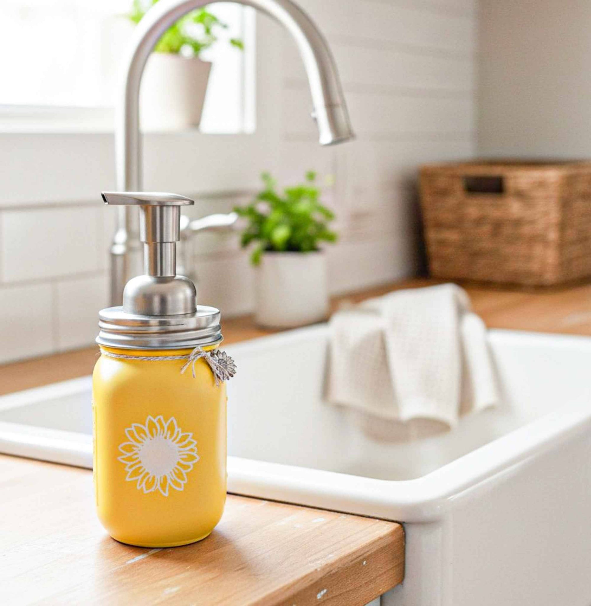 Farmhouse Whimsy sunflower mason jar soap dispenser with a classic glass jar and sunflower design, ideal for farmhouse kitchens or bathrooms.