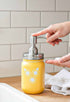 Farmhouse Whimsy sunflower mason jar soap dispenser, vintage-style soap jar with sunflower design for rustic decor.