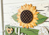 Sunflower-themed table top decor set with tiered blocks from Farmhouse Whimsy, featuring bright sunflower illustrations.