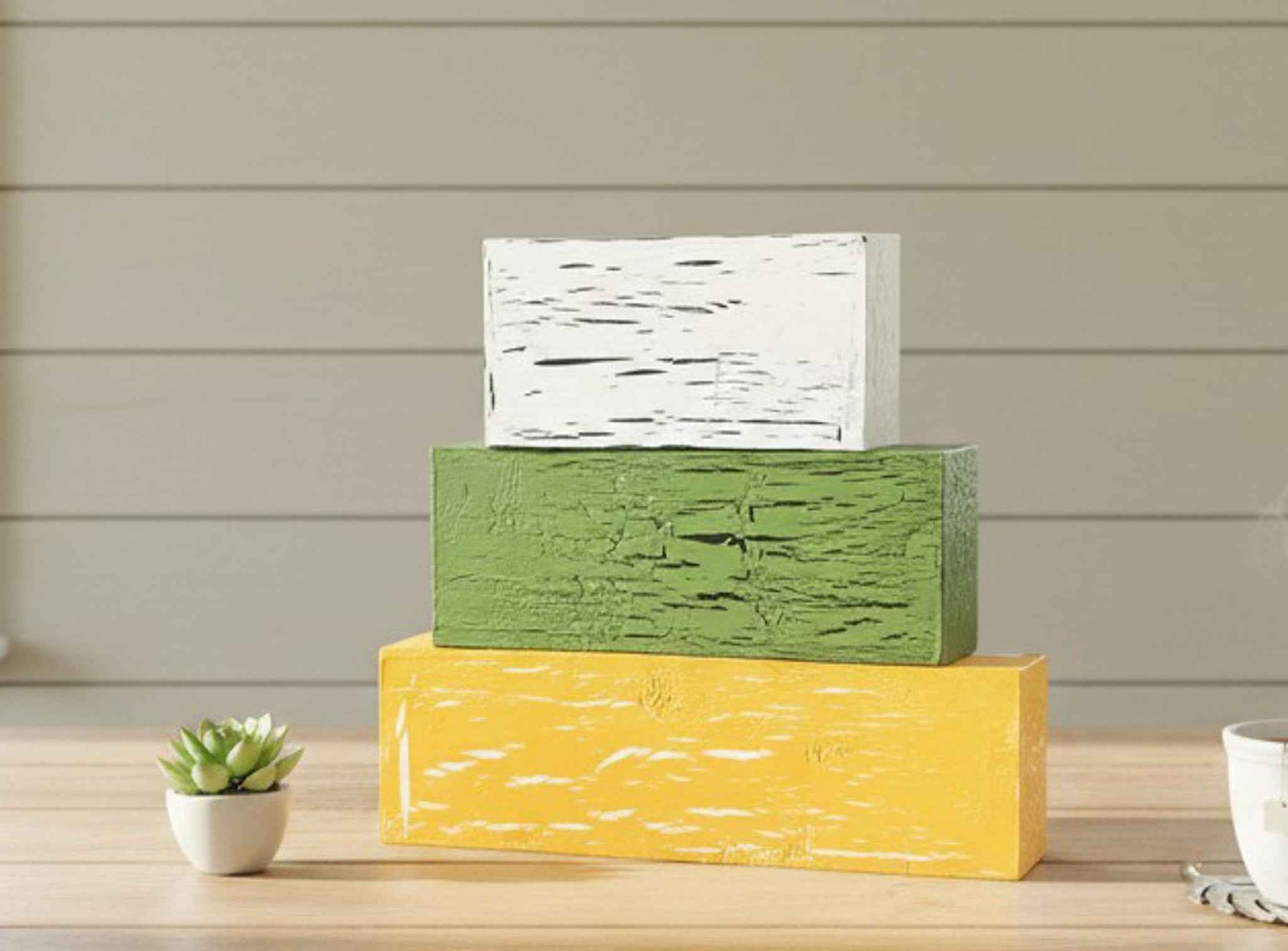 Sunflower-themed table top decor with tiered block set from Farmhouse Whimsy, featuring wooden blocks with sunflower designs.